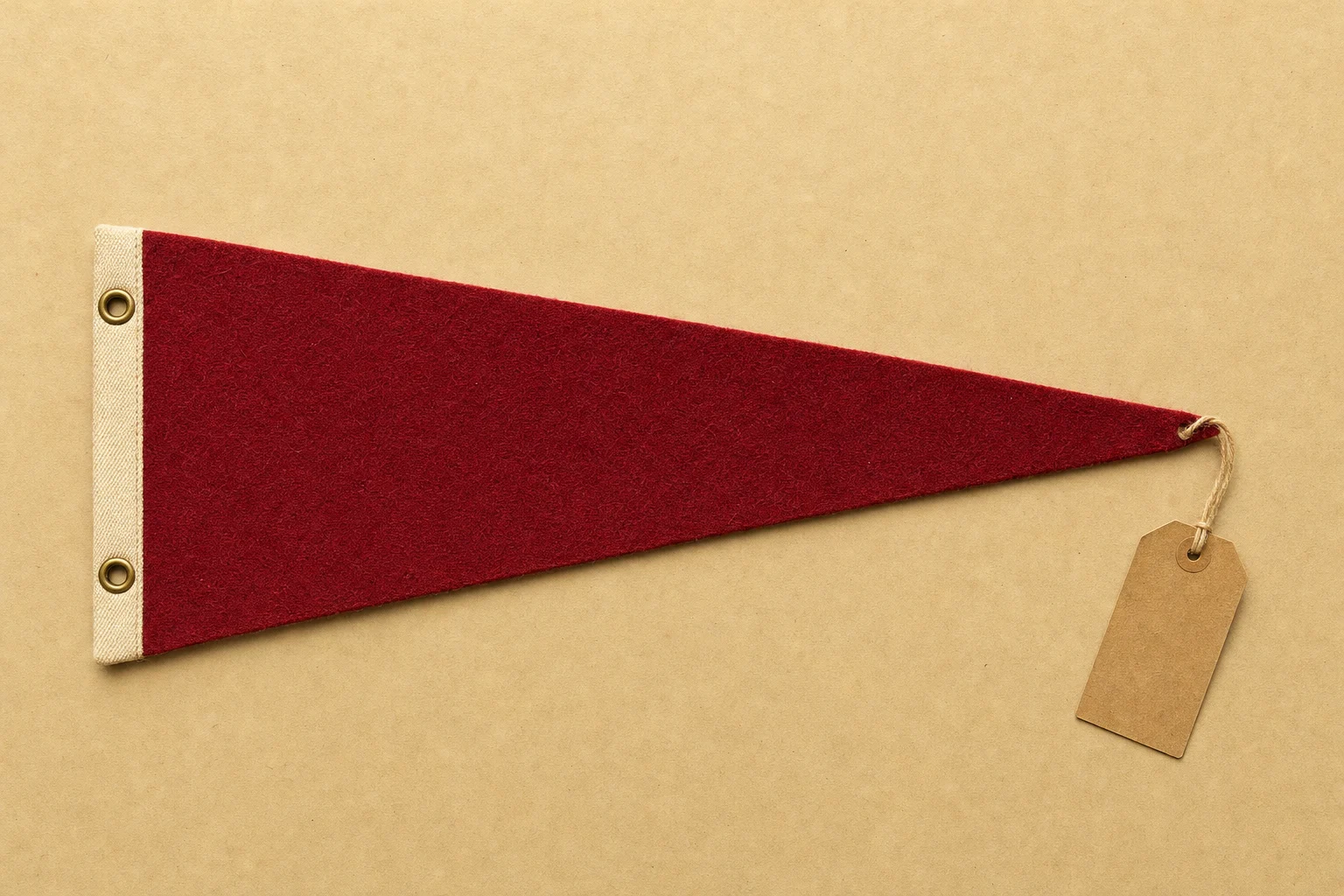A red felt pennant with a blank tag