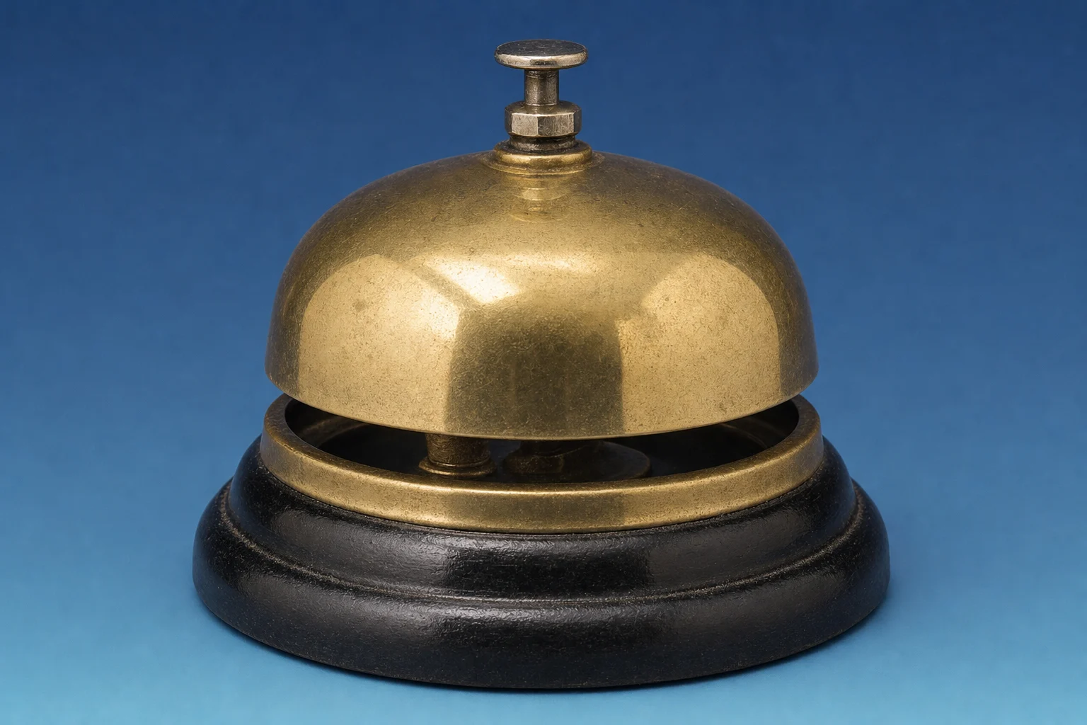 A brass shop-counter service bell